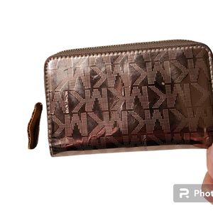 Beautiful Michael Kors zip around wallet...almost perfect condition, see picture